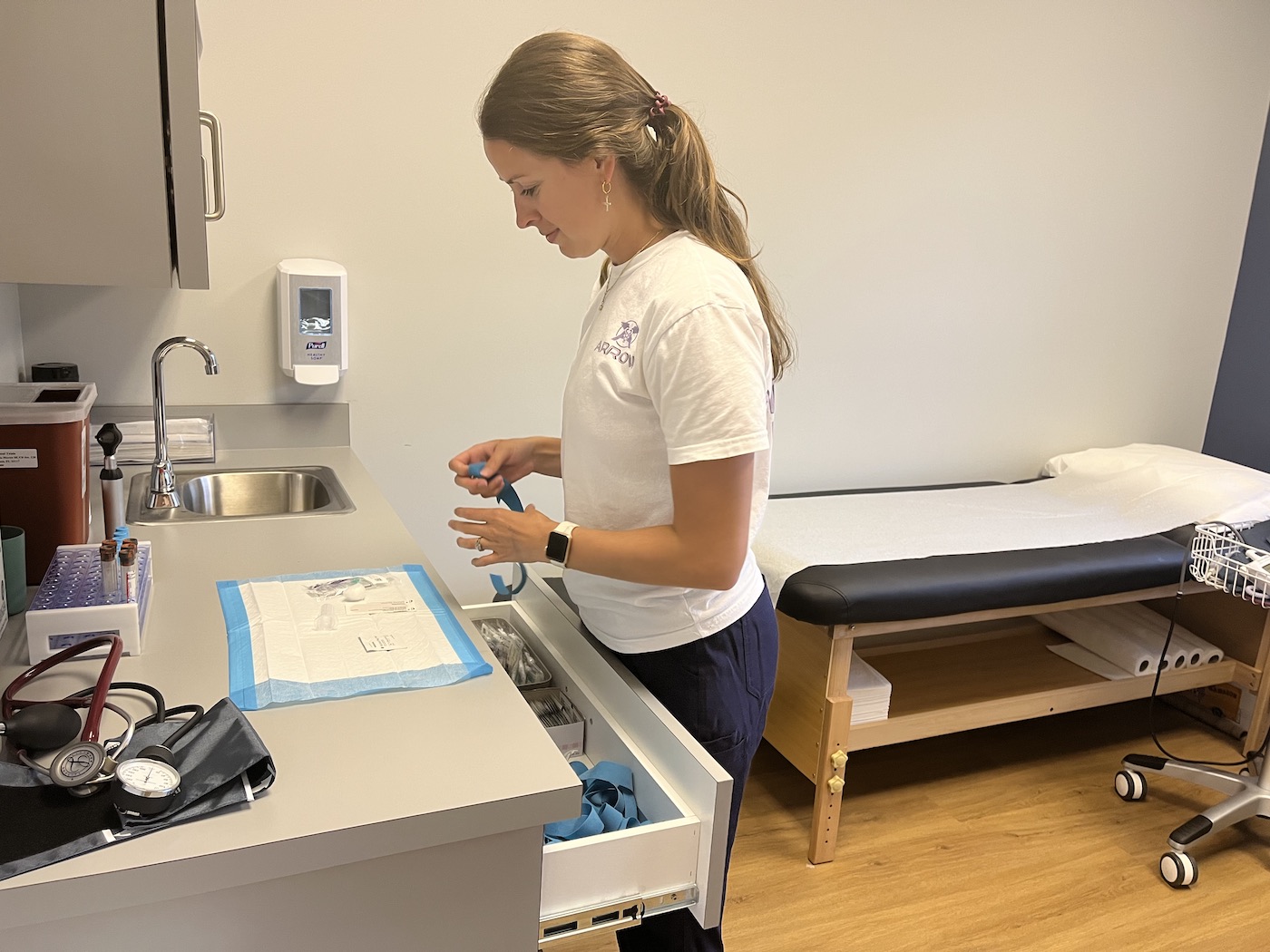 Arrow clinical staff preparing for a participant visit in an exam room